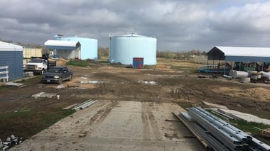 New industrial site under construction with tanks and conduit staged
