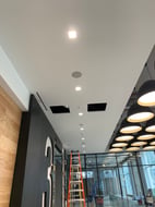 Commercial lobby ceiling with lighting, speakers and low-voltage devices