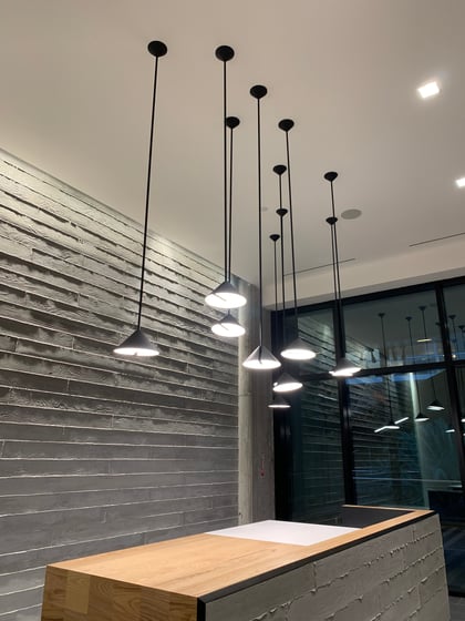Commercial reception area with pendant lighting installed by Adrian Electric