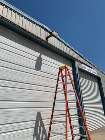 LED wall pack light installed on a metal building