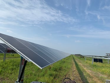 Rows of ground-mounted solar panels at a solar farm
