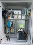 Industrial control panel with PLC and wiring built by Adrian Electric