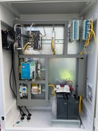 Industrial control panel with PLC and networking hardware