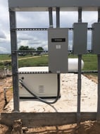 Commercial standby generator with transfer switch on a steel rack