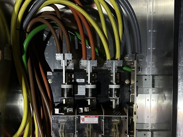 Service conductors landed on a 2,000-amp fused service disconnect